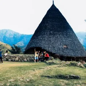GROUP PHOTO in front of WAE REBO TRADITIONAL house mbaru niang